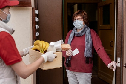 food-delivery-service Someone delivering bananas, bread, and milk