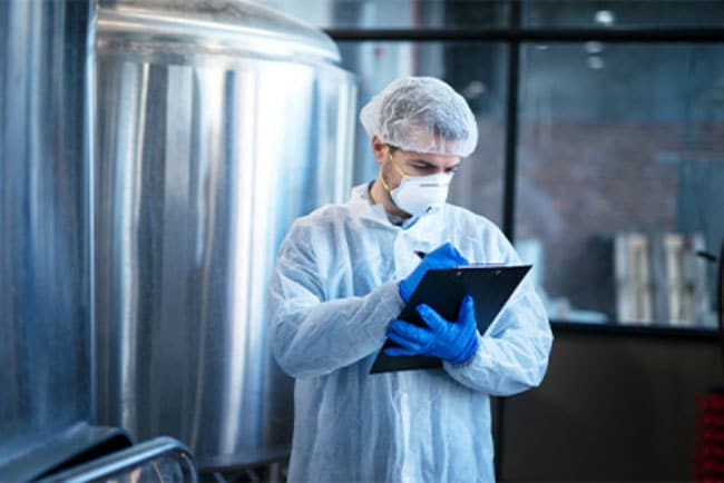 Food researcher writing on clipboard